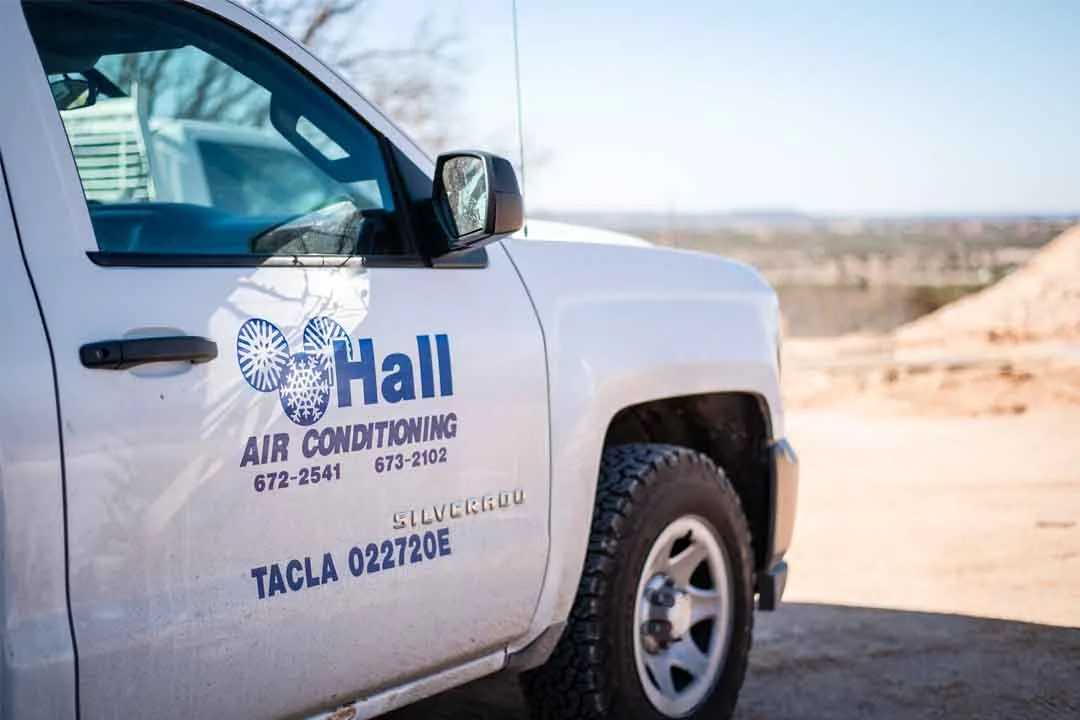 Hall Air Conditioning service truck lettered with its TACLA license number