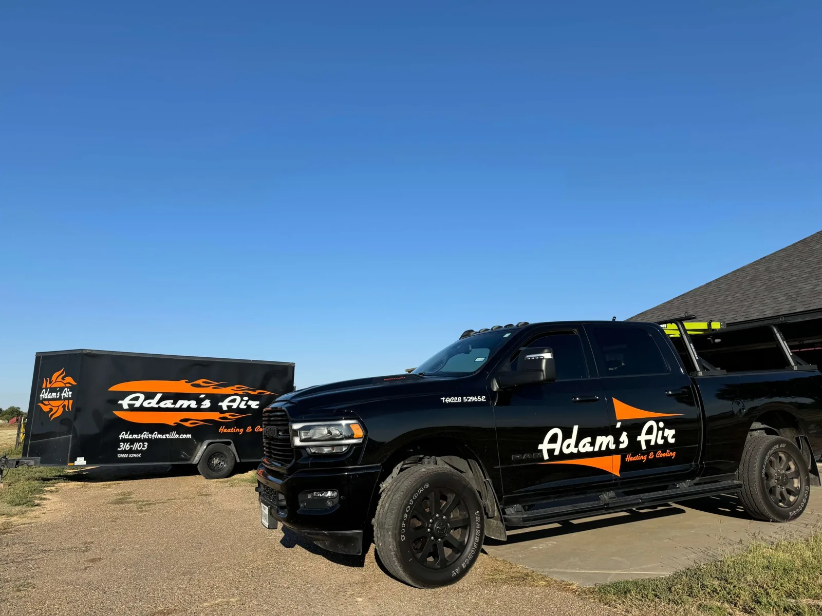 Adam's Air pickup and trailer, with the TDLR license number on the doors
