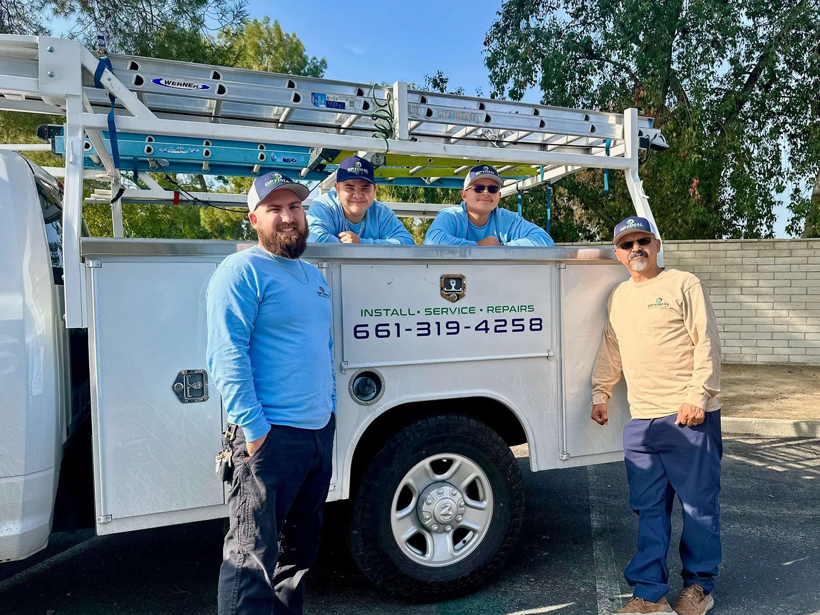 Optimal Heating & Air crew with their service truck