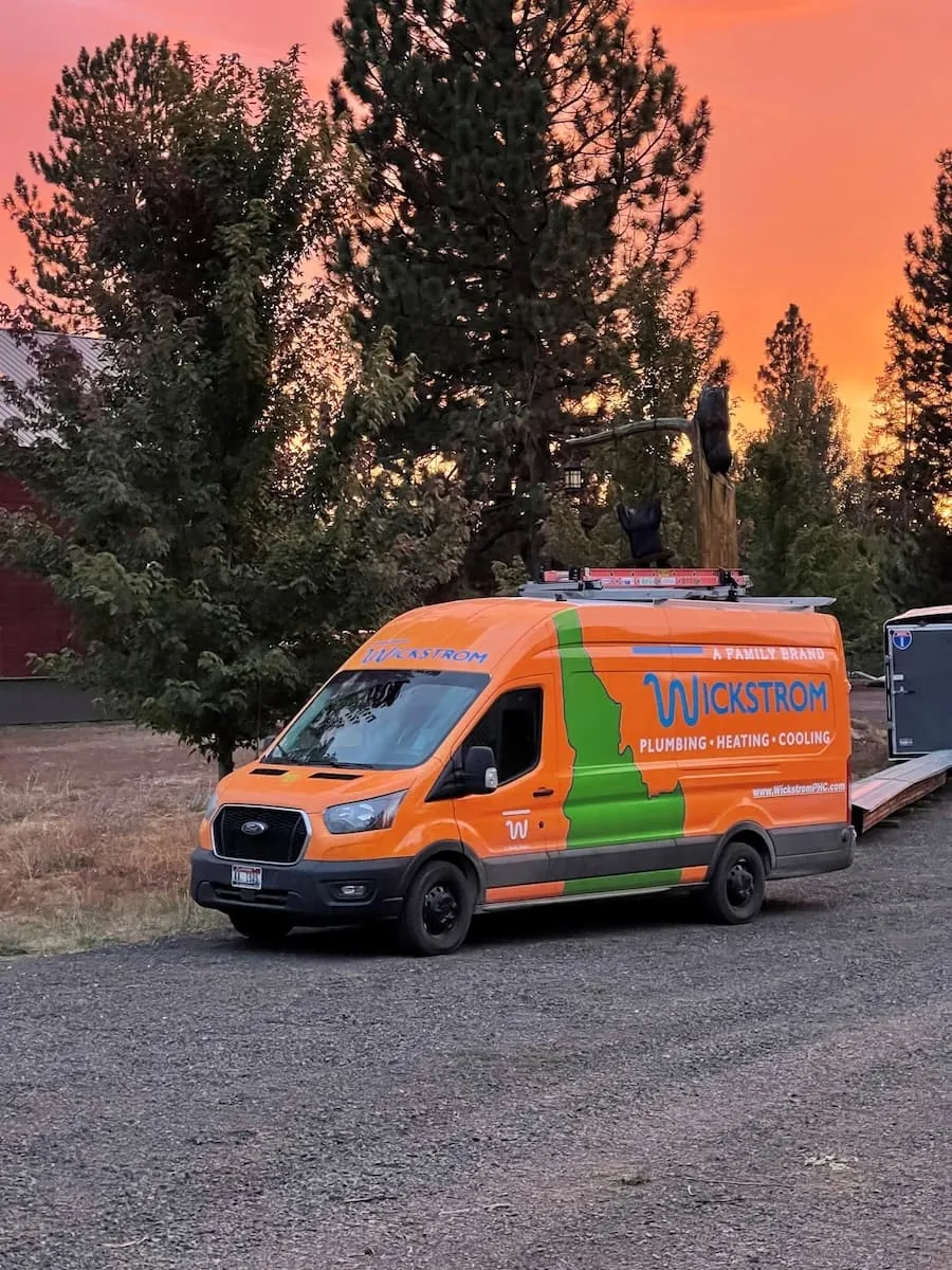 Wickstrom service van parked at a rural property at sunset