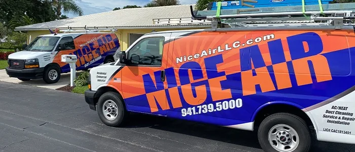 Nice Air wrapped service vans parked on a street