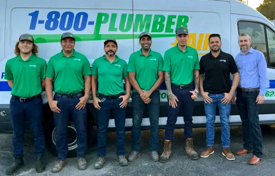 1-800-Plumber +Air Clearwater team in front of a service van