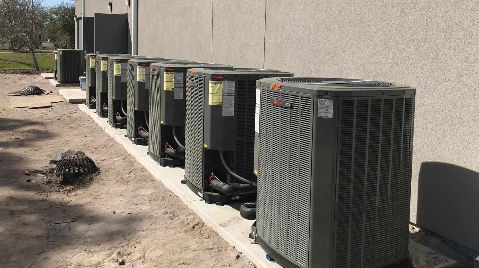 Row of newly installed condensing units at a commercial job