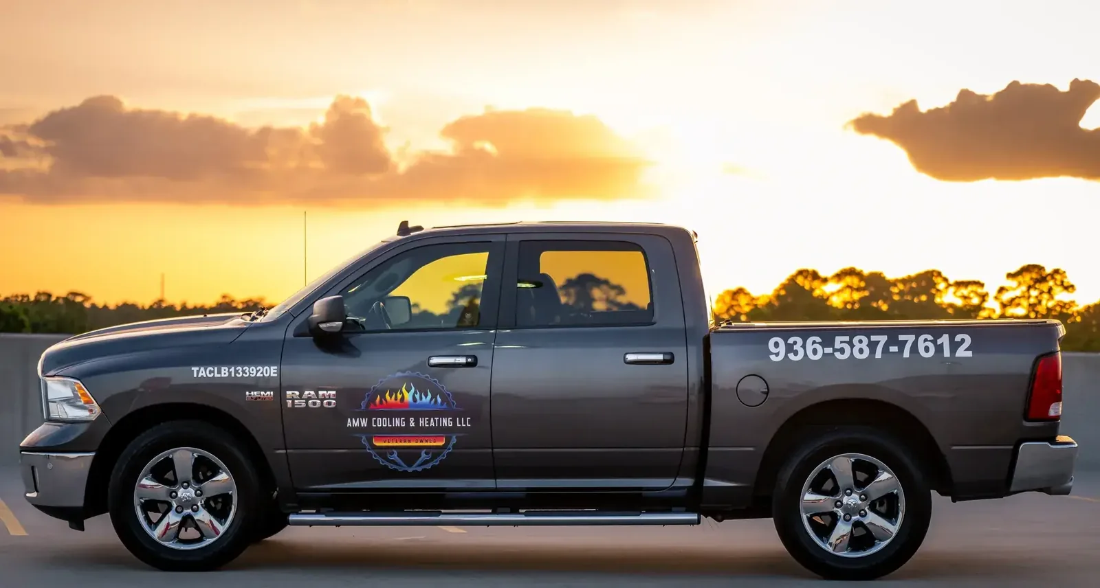AMW Cooling & Heating pickup truck with the company logo and license number
