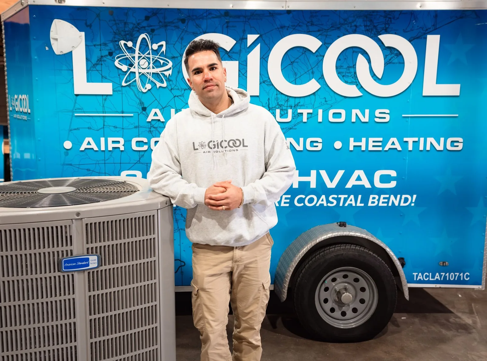 Owner Joven Schlatter beside a Logicool Air Solutions trailer