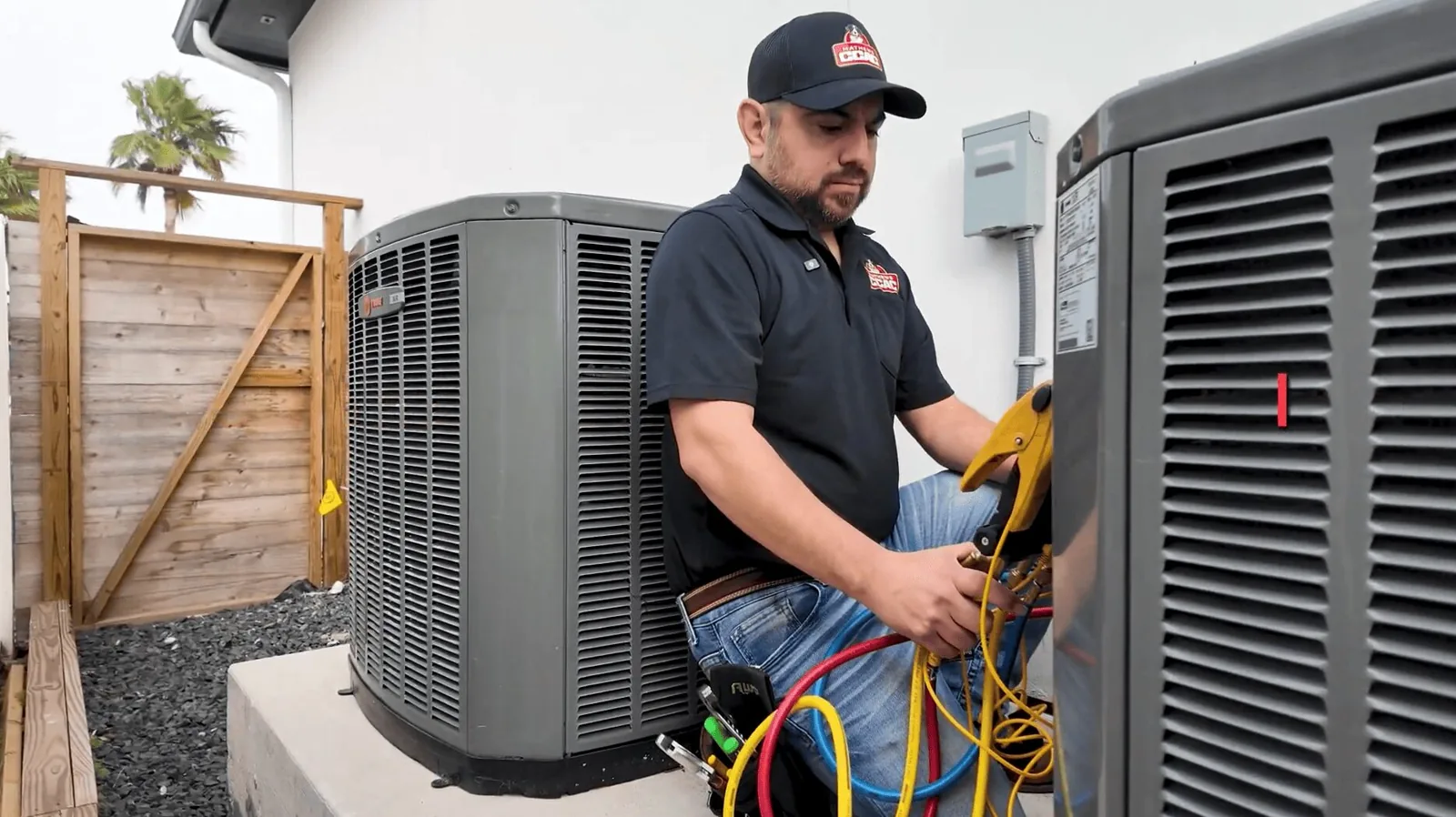 Mathews CCAC technician servicing an outdoor air conditioning unit