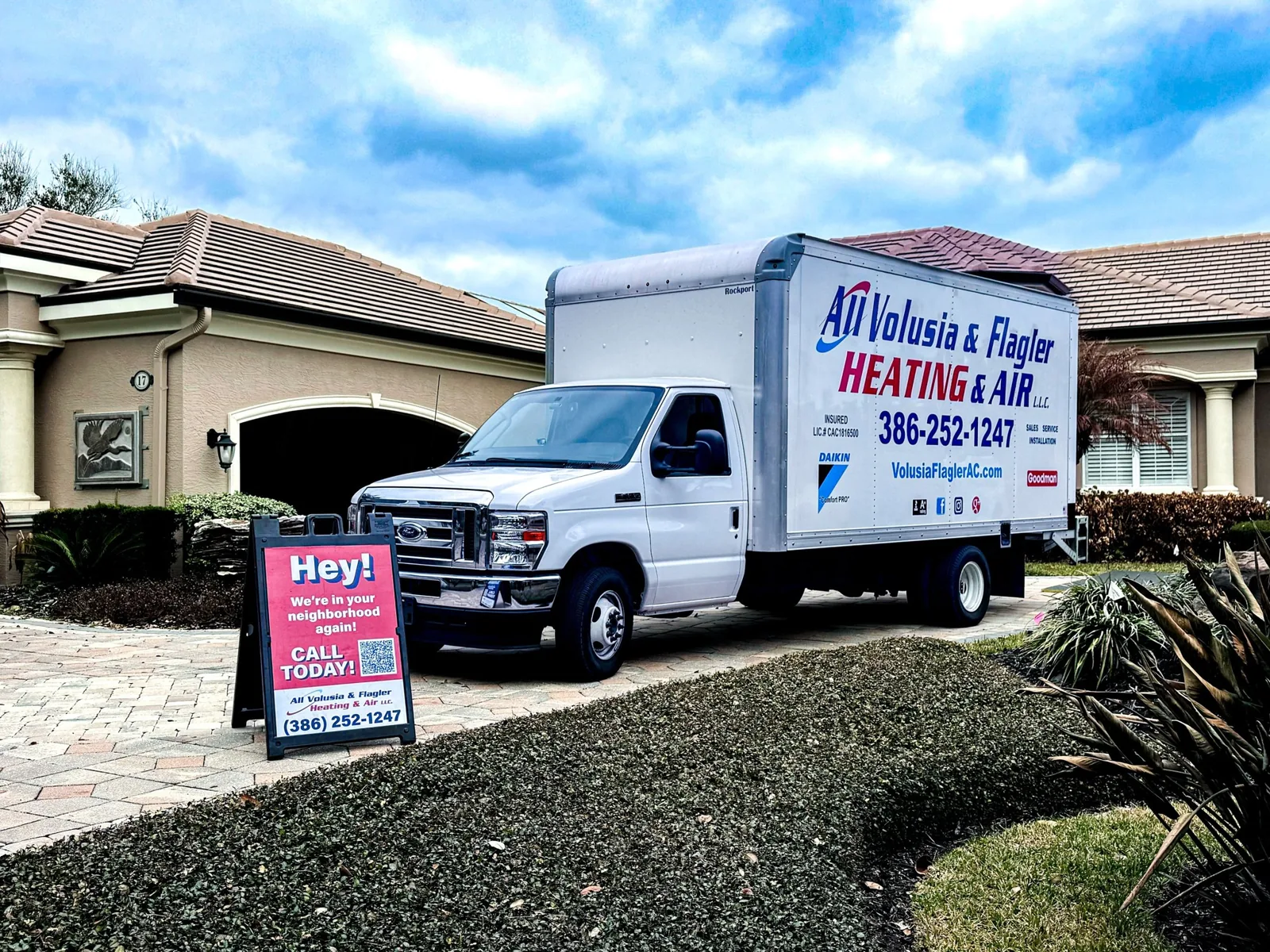 All Volusia & Flagler Heating & Air box truck at a customer's home