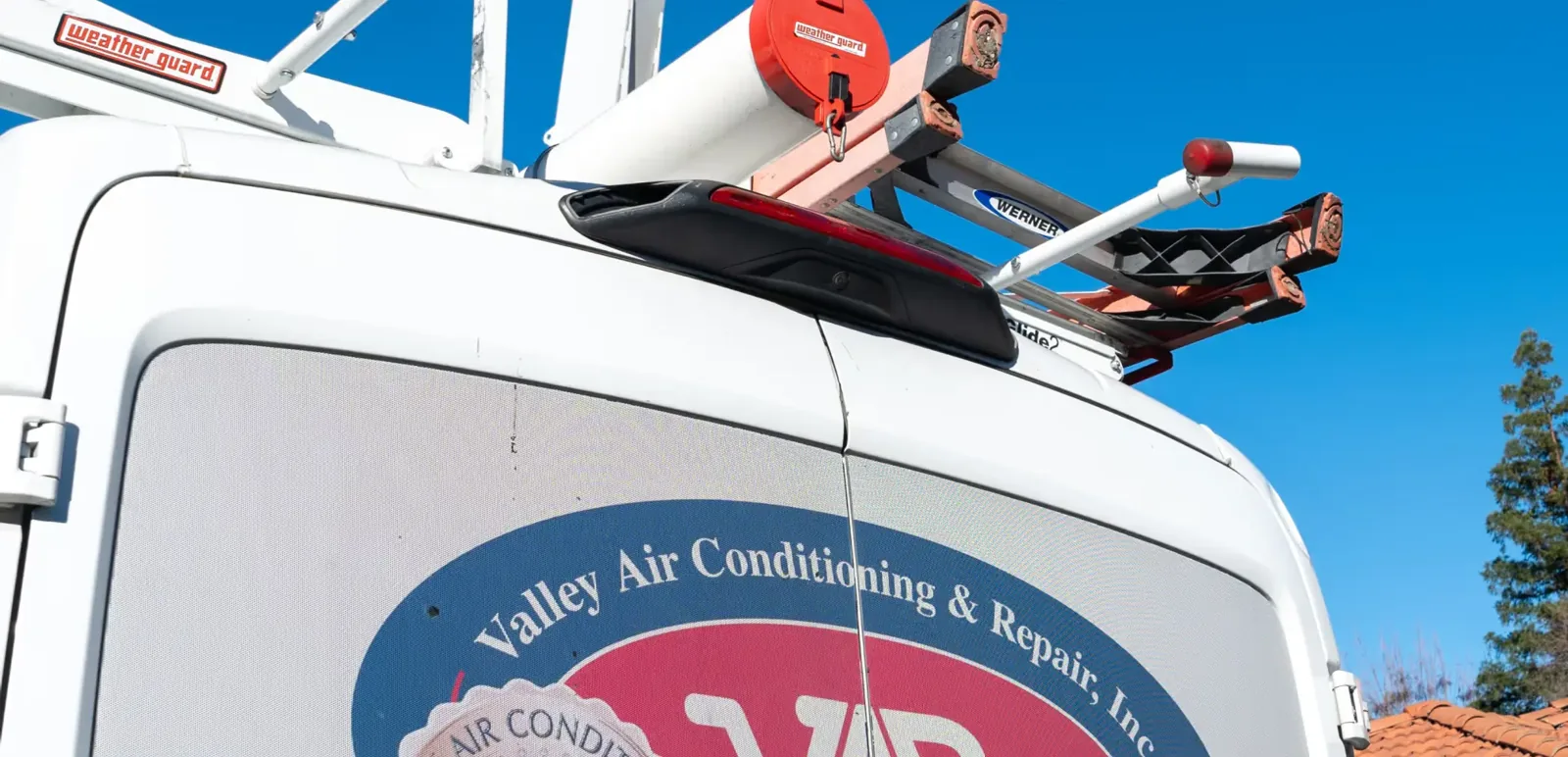 Valley Air Conditioning & Repair service van with the VAR logo