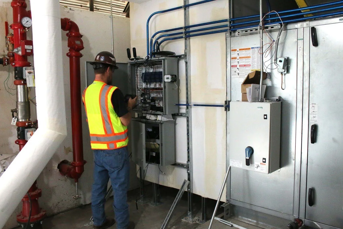 CWS Services technician working on an air handler control panel