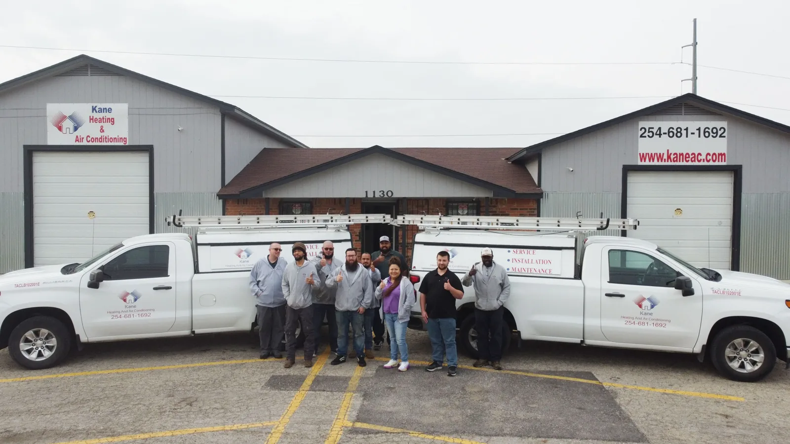 Kane Heating & Air Conditioning team and trucks outside the Harker Heights office