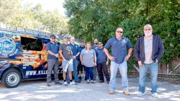 Killeen Heating & Air Conditioning staff with a wrapped service van