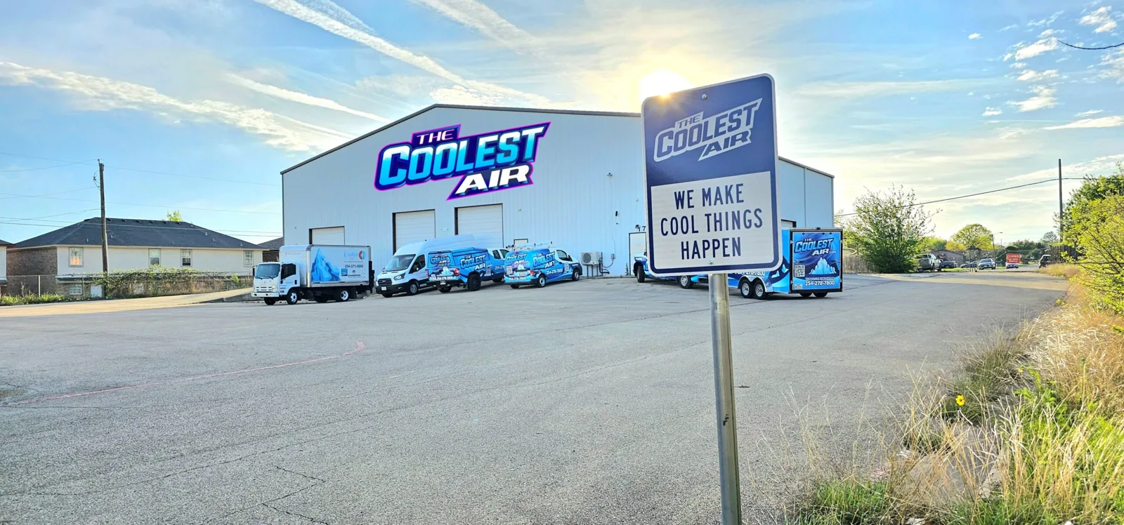 The Coolest Air shop building on Martin Luther King Jr Blvd with its service vans