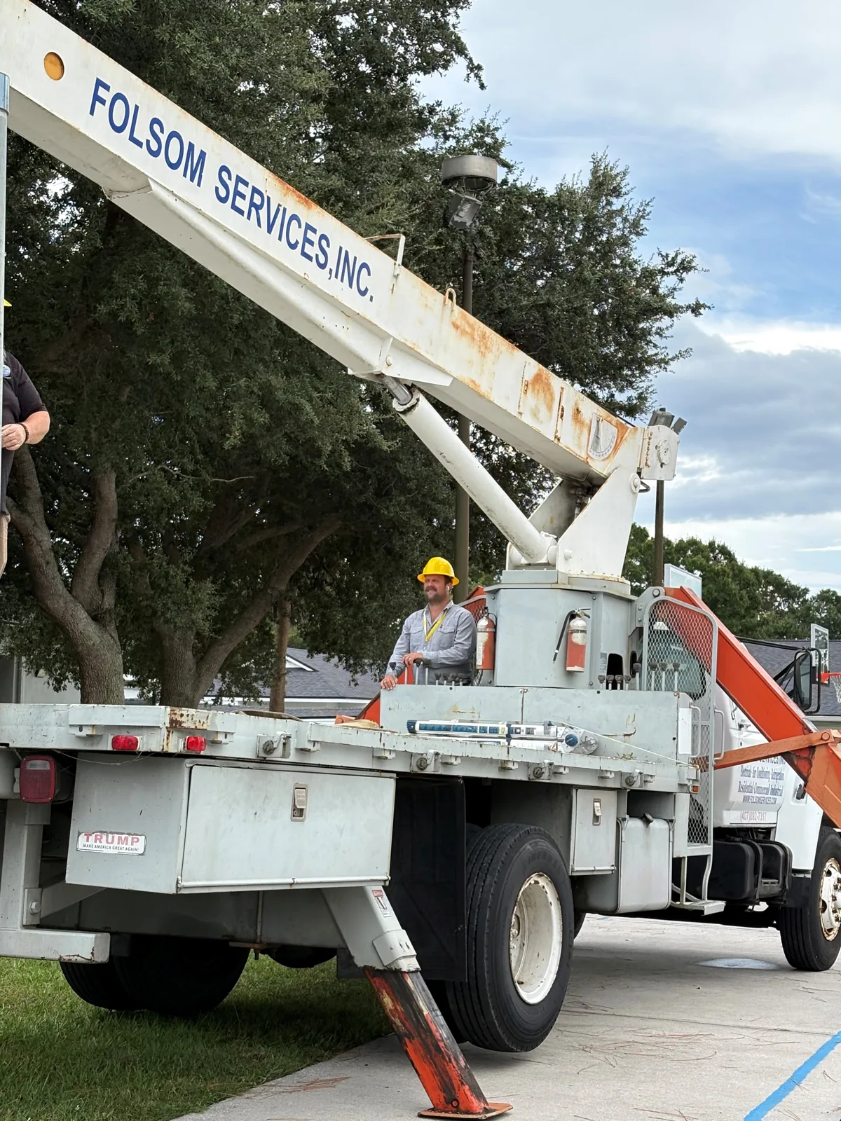 Folsom Services boom truck on a job site