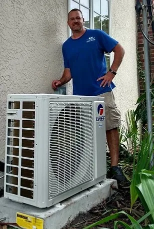 Fallin's technician beside a newly installed outdoor mini-split unit