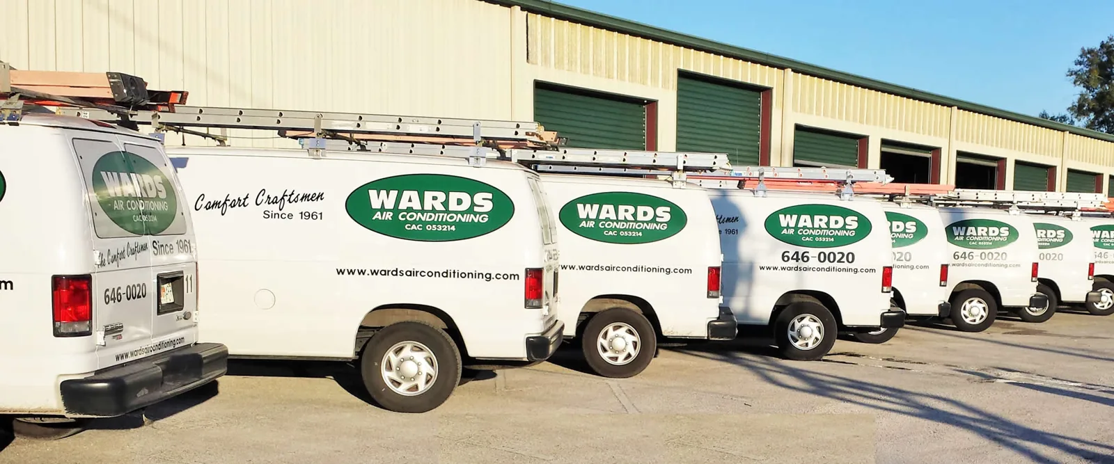 Row of Ward's Air Conditioning service vans