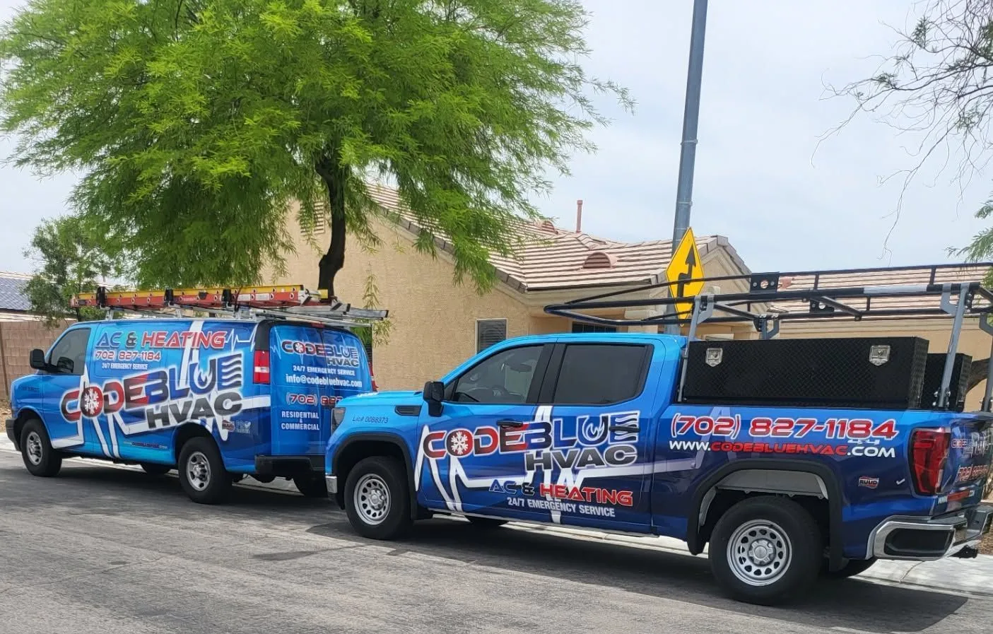 Code Blue HVAC van and pickup truck parked on a Las Vegas Valley street