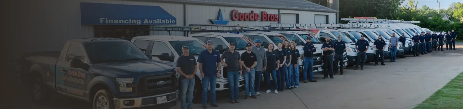 Goode Bros. team lined up with service trucks and vans outside the Longview shop