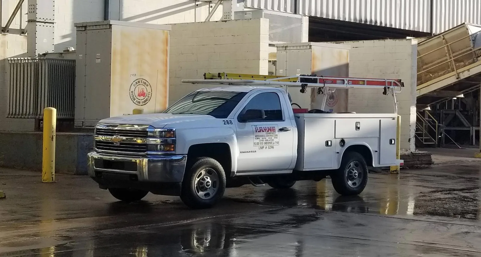 Payne Mechanical Services service truck at a commercial job site