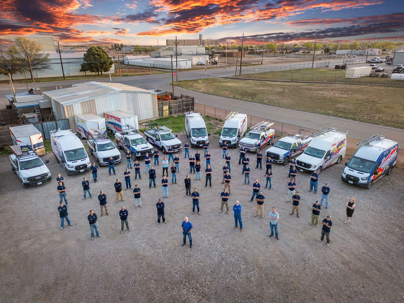 Comfort Masters staff and service fleet at the Lubbock shop