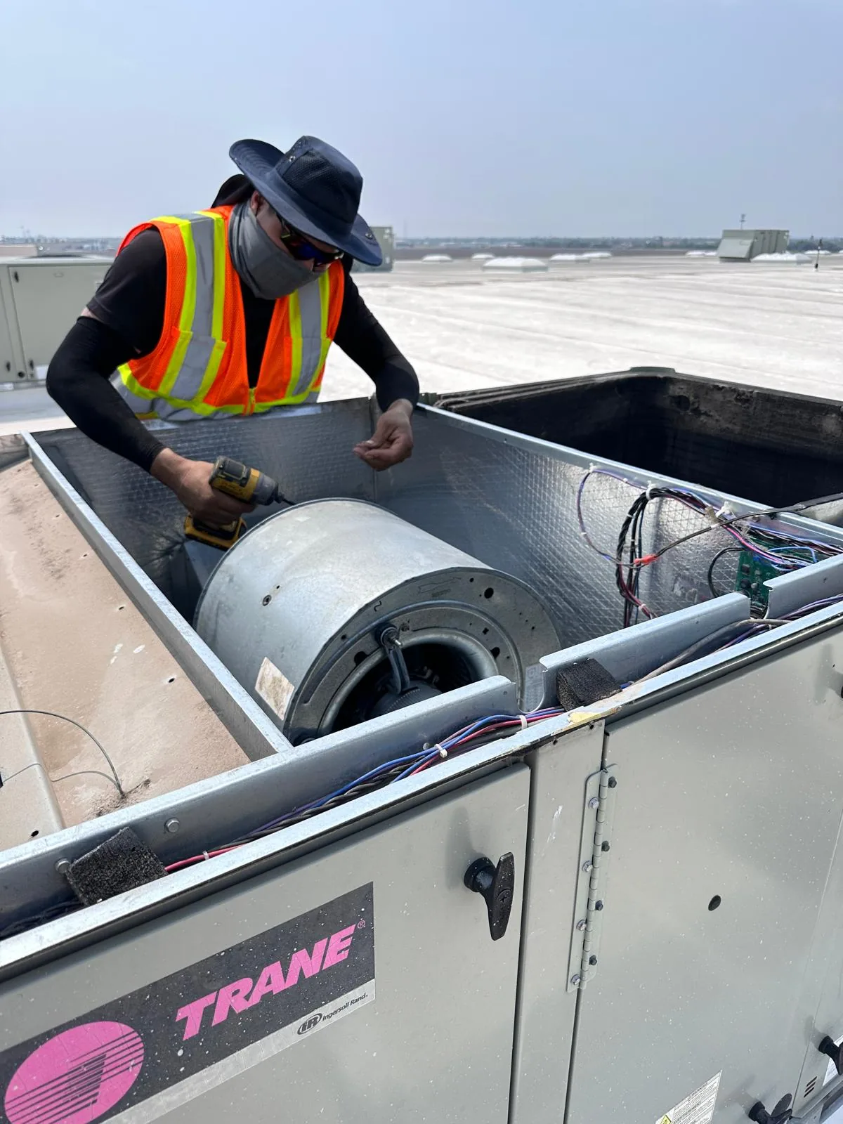 Air Master technician servicing a rooftop package unit