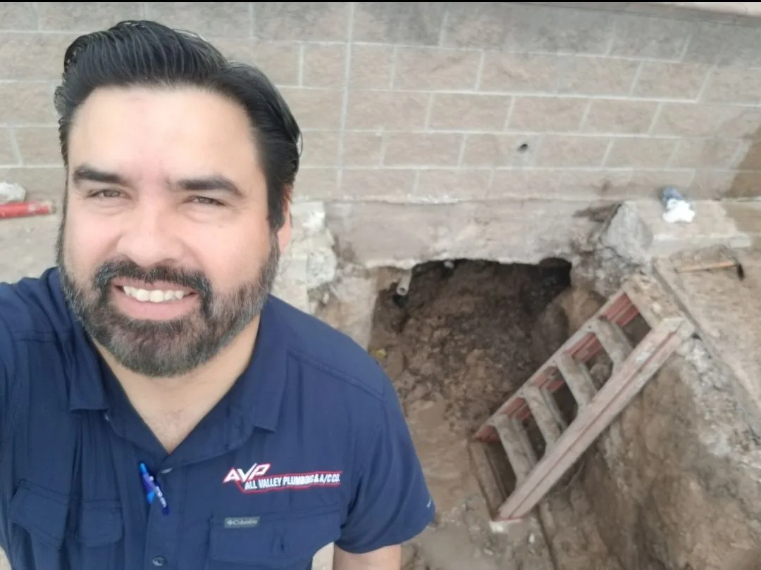 All Valley technician in a company shirt on a job site