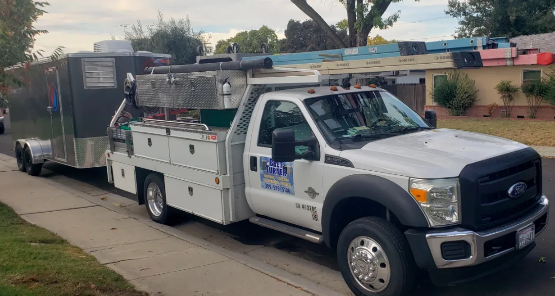 Bret Turner Heating and Cooling service truck with equipment trailer