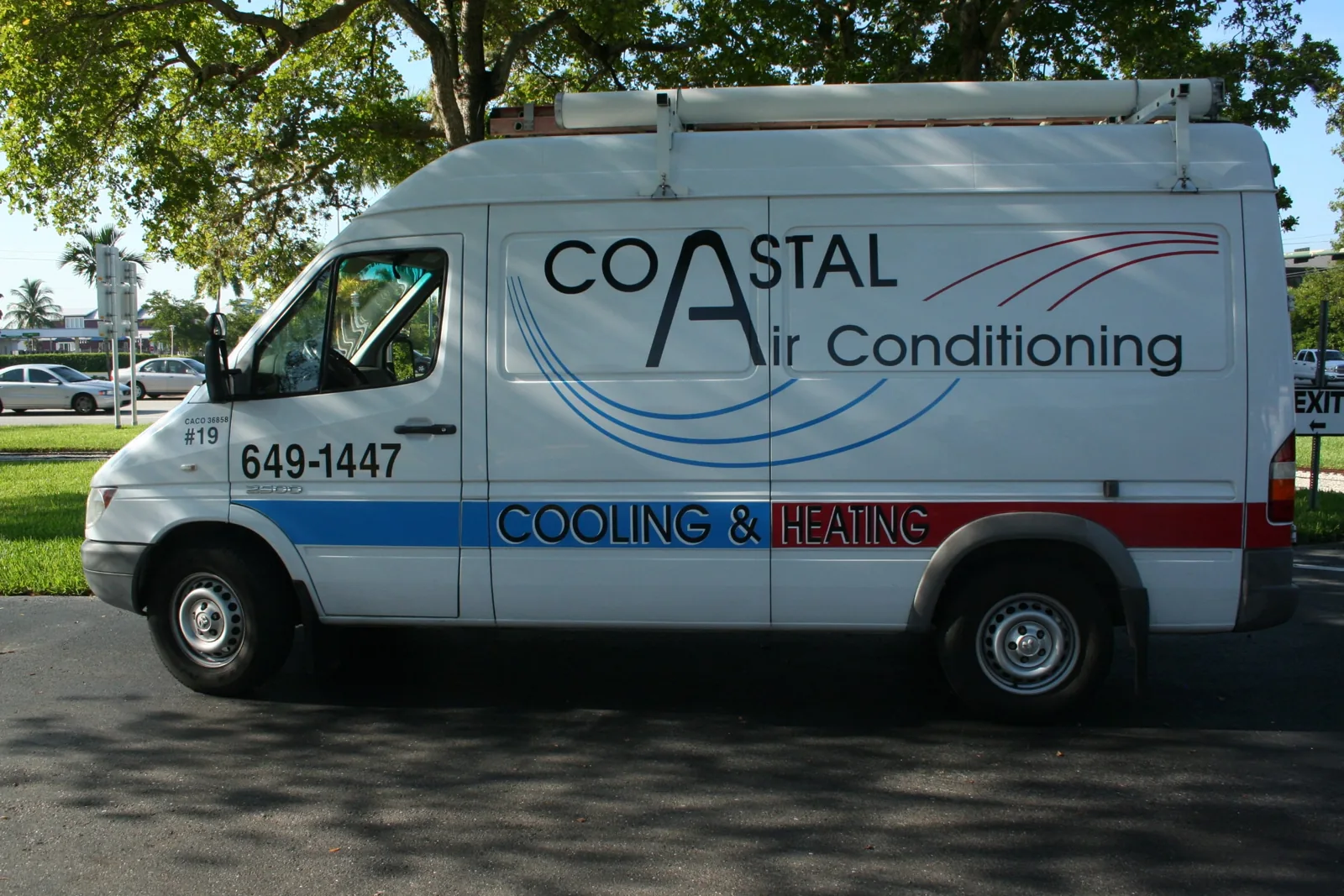 Coastal Air Conditioning service van with the company phone number
