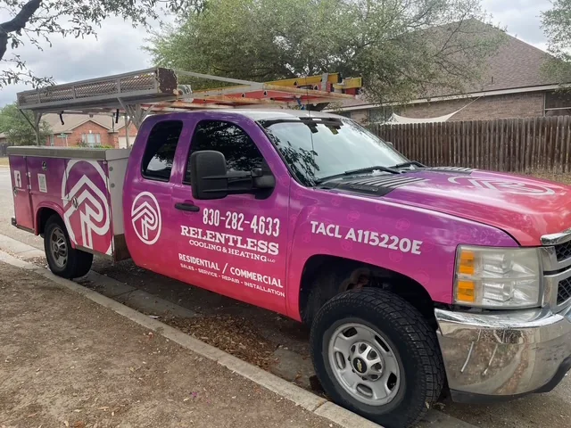 Relentless Cooling & Heating pickup truck with its TDLR license number on the door