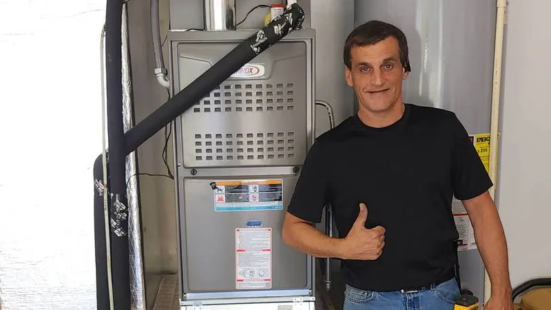 IDR HVAC Solutions owner next to a newly installed Lennox furnace