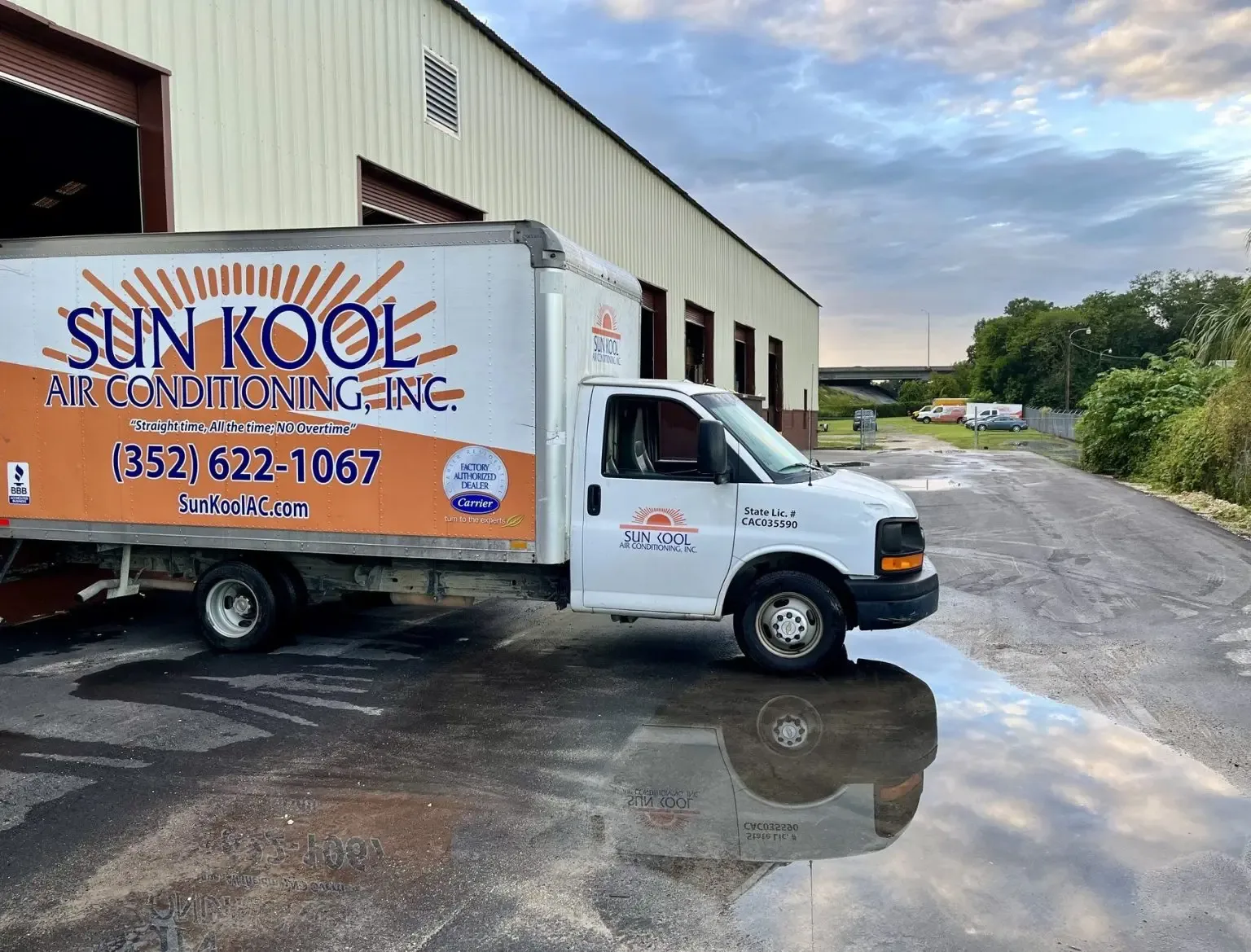 Sun Kool Air Conditioning box truck outside the company building