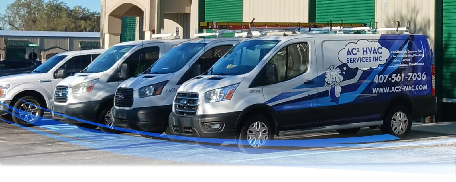 Row of AC² HVAC Services branded vans