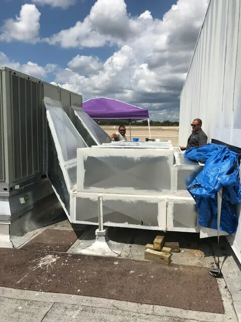 BRG Air Systems crew working on a commercial rooftop unit