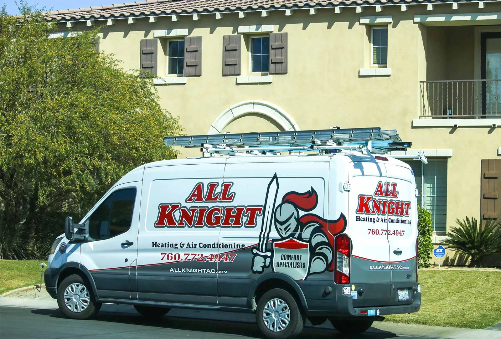 All Knight Heating & Air Conditioning service van outside a home