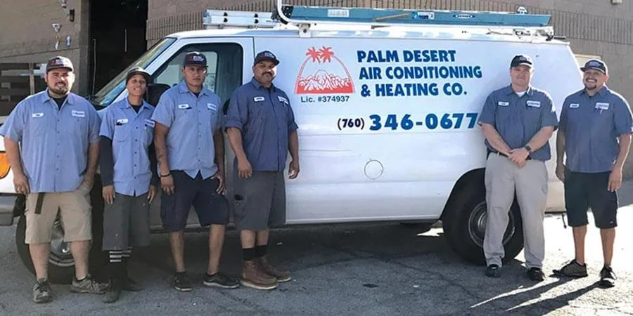 Palm Desert Air Conditioning and Heating Co. technicians in front of a company van