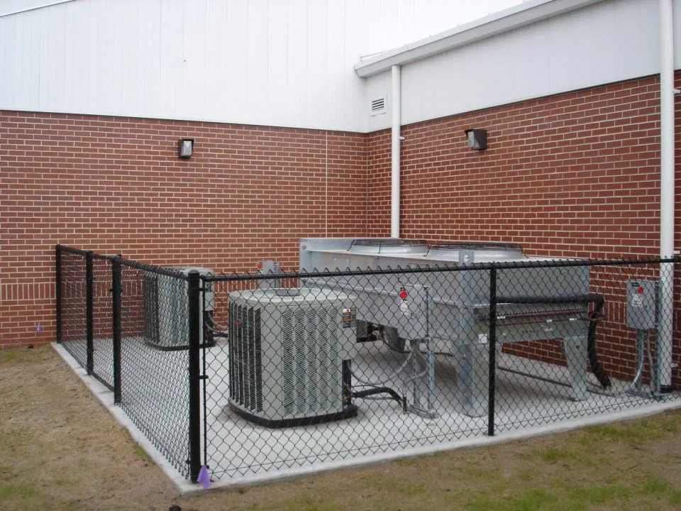 Condensing units installed by AAA behind a fenced pad