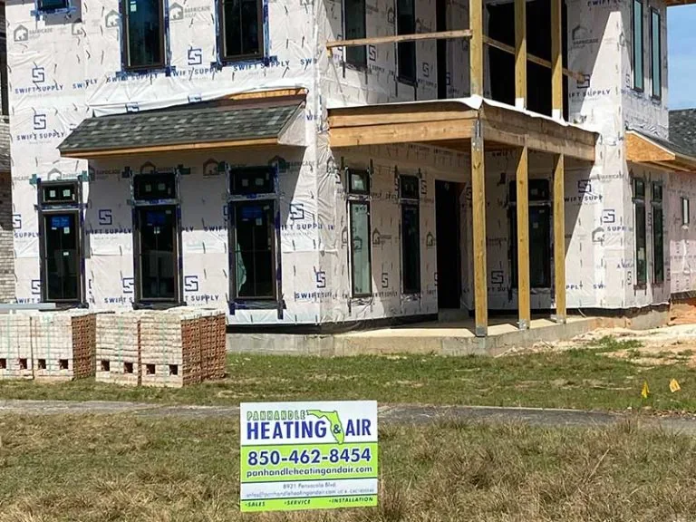 New-construction house with a Panhandle Heating & Air job sign