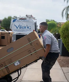 Viking technician moving new equipment from a Viking van