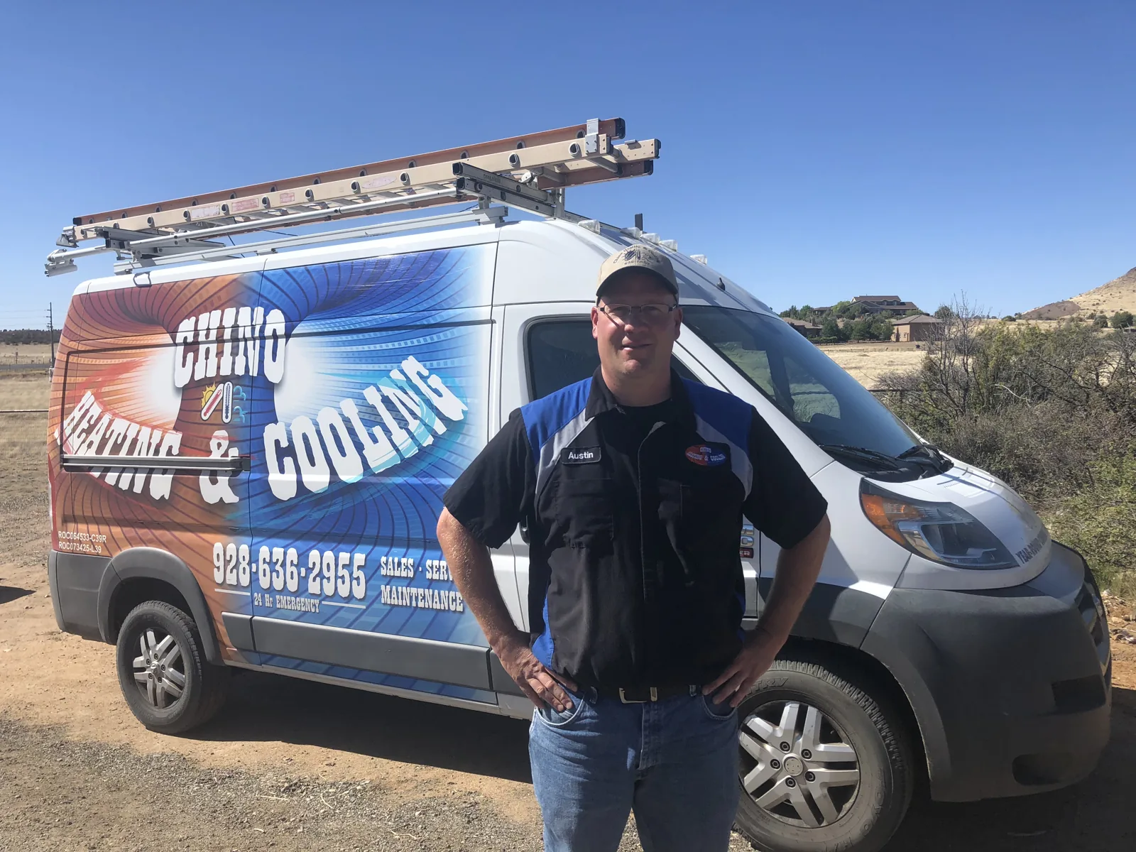 Chino Heating & Cooling team member beside a company van