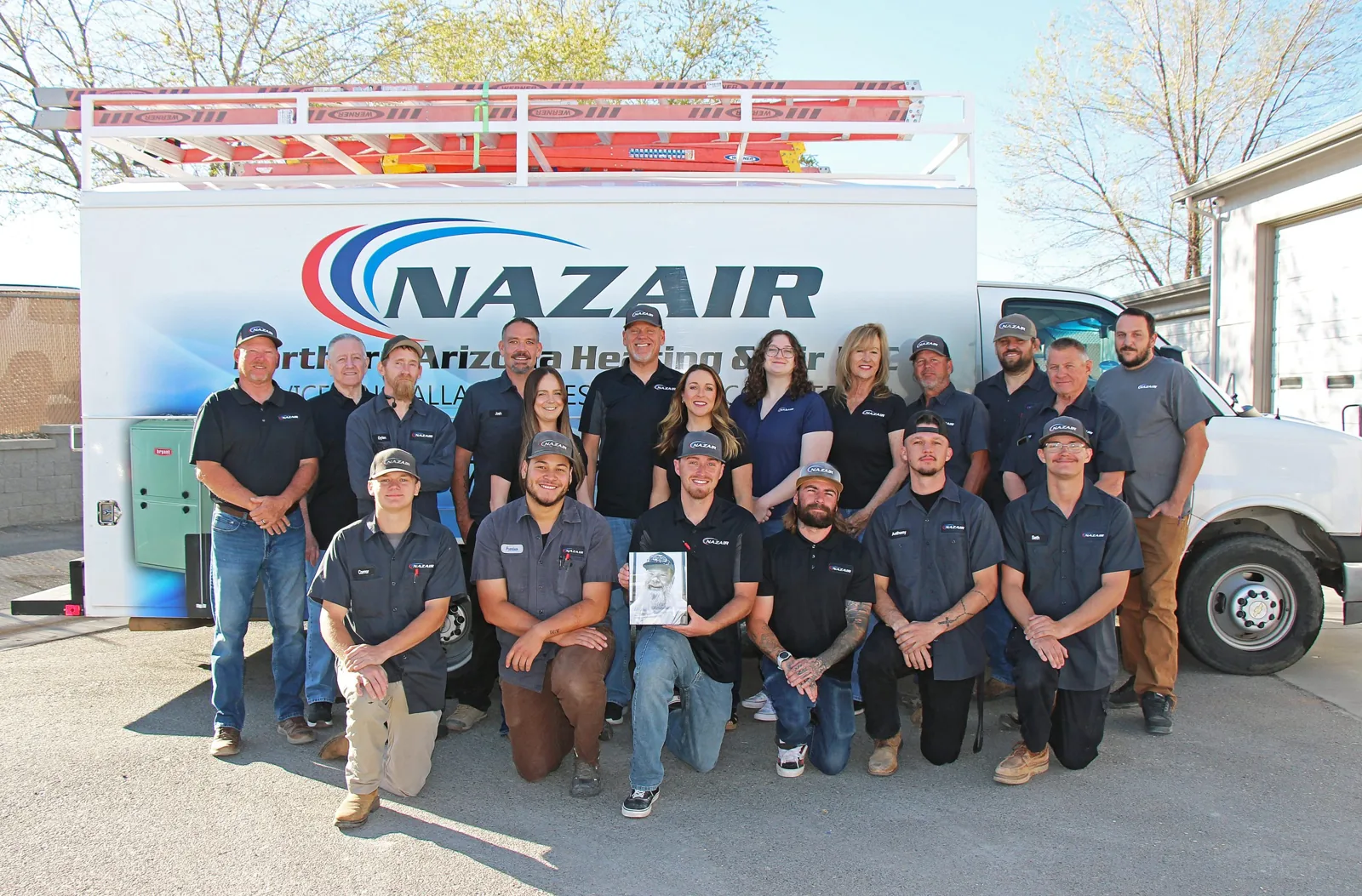 Northern Arizona Heating & Air staff in front of a company van