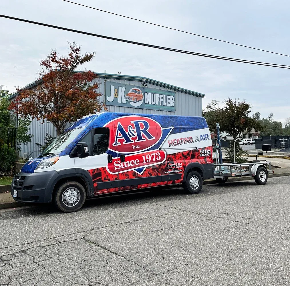 A & R Heating & Air Conditioning service van with equipment trailer