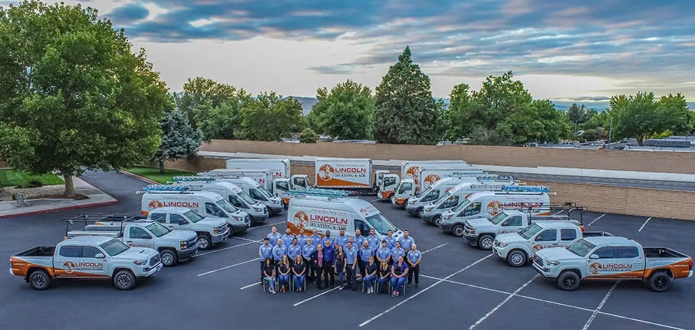 Lincoln Heating & Air team with the company fleet