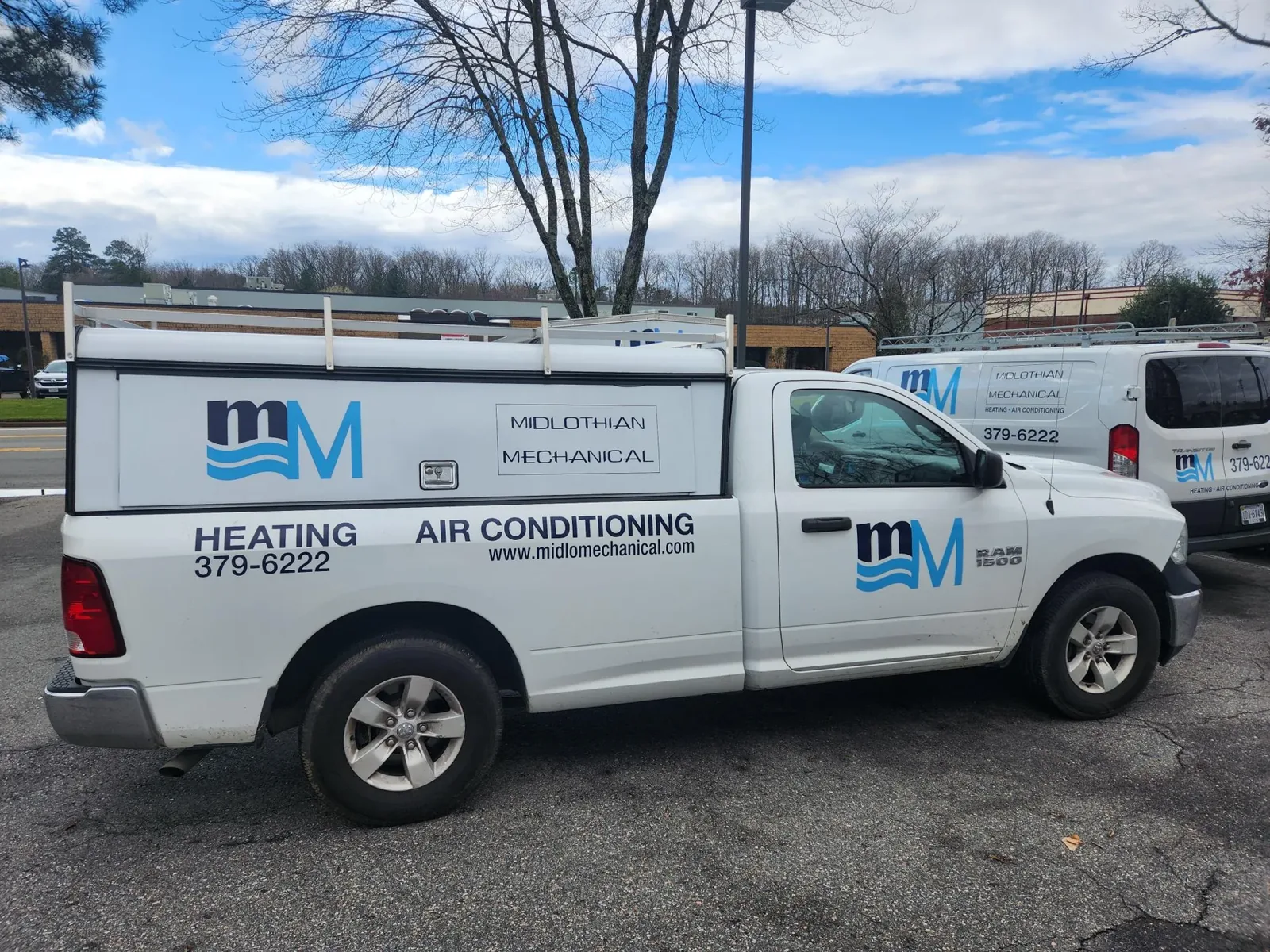 Midlothian Mechanical service pickup and van outside the shop