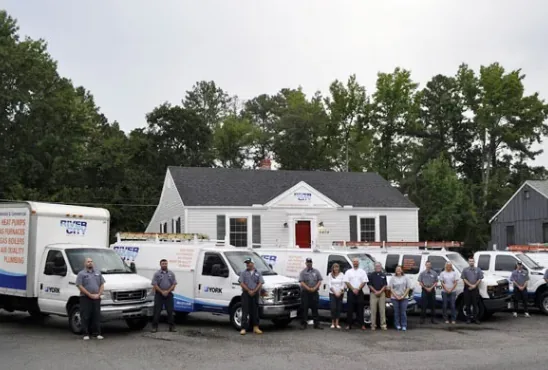 River City Heating & Air crew with its service trucks