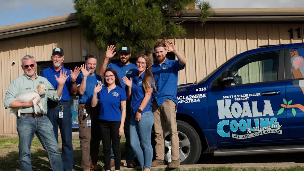 Koala Cooling & Plumbing team with a branded truck at the Round Rock office