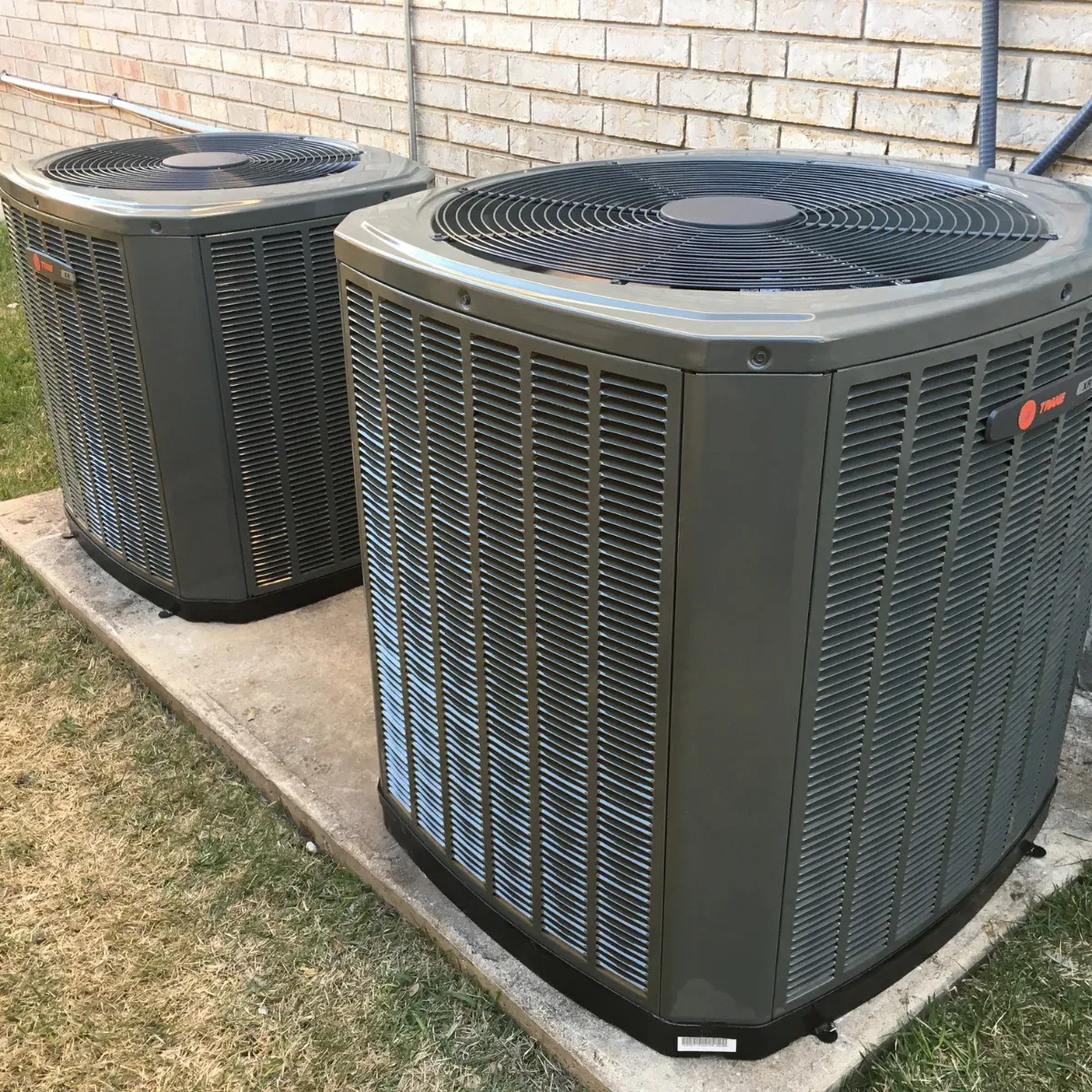 Two outdoor condensing units installed by Air Pros of S.A.
