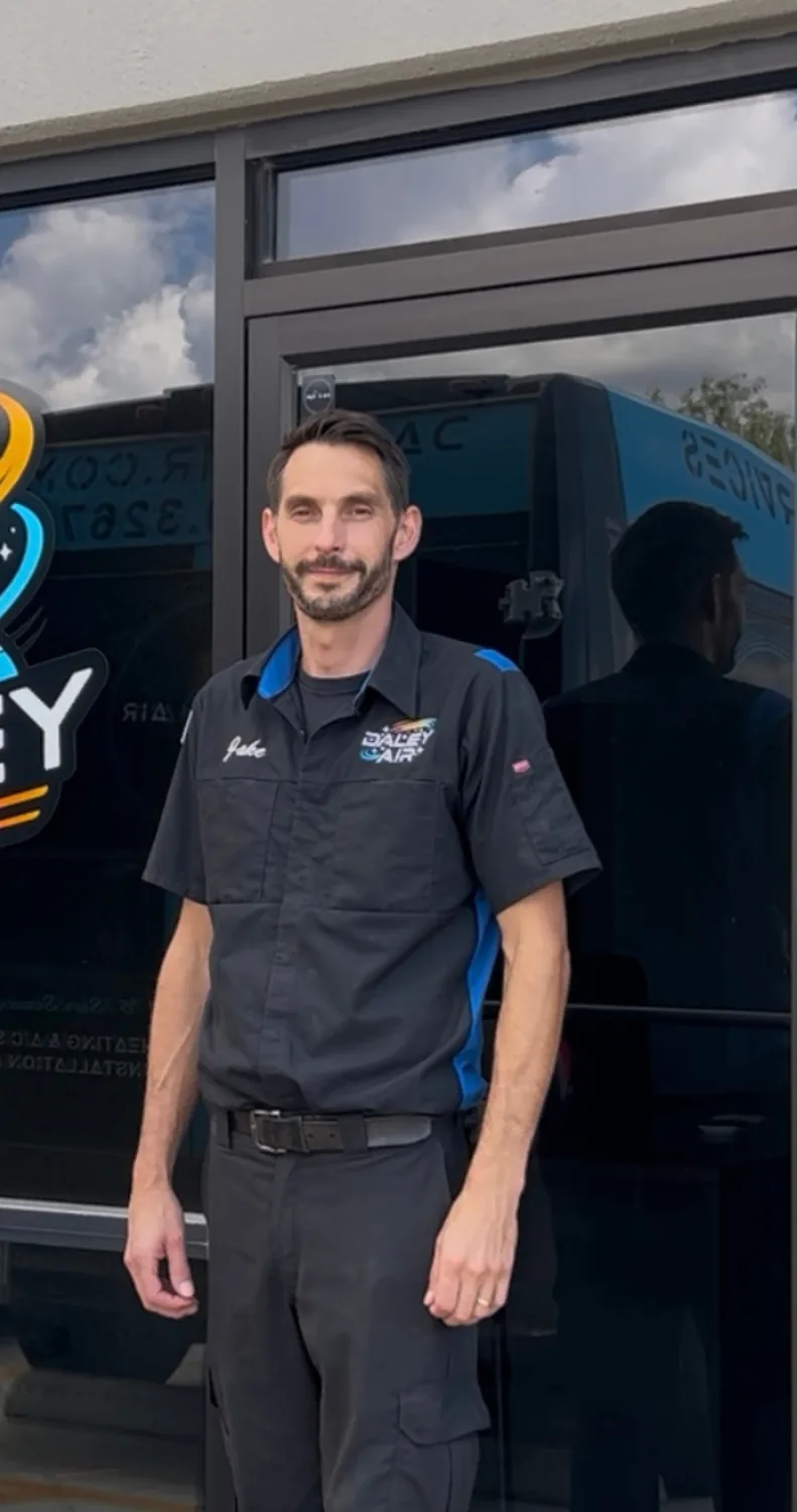 Daley Air technician outside the company office
