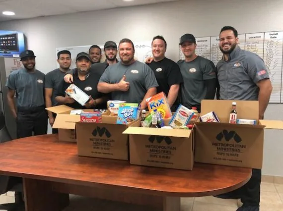 Fontana Brothers team gathered in the company office
