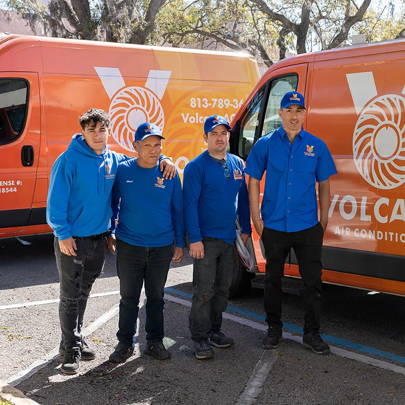 Volcano Air Conditioning crew in front of two company vans