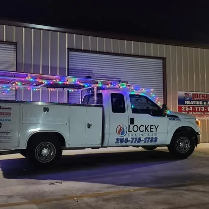 Lockey Heating & Air service truck parked outside the shop