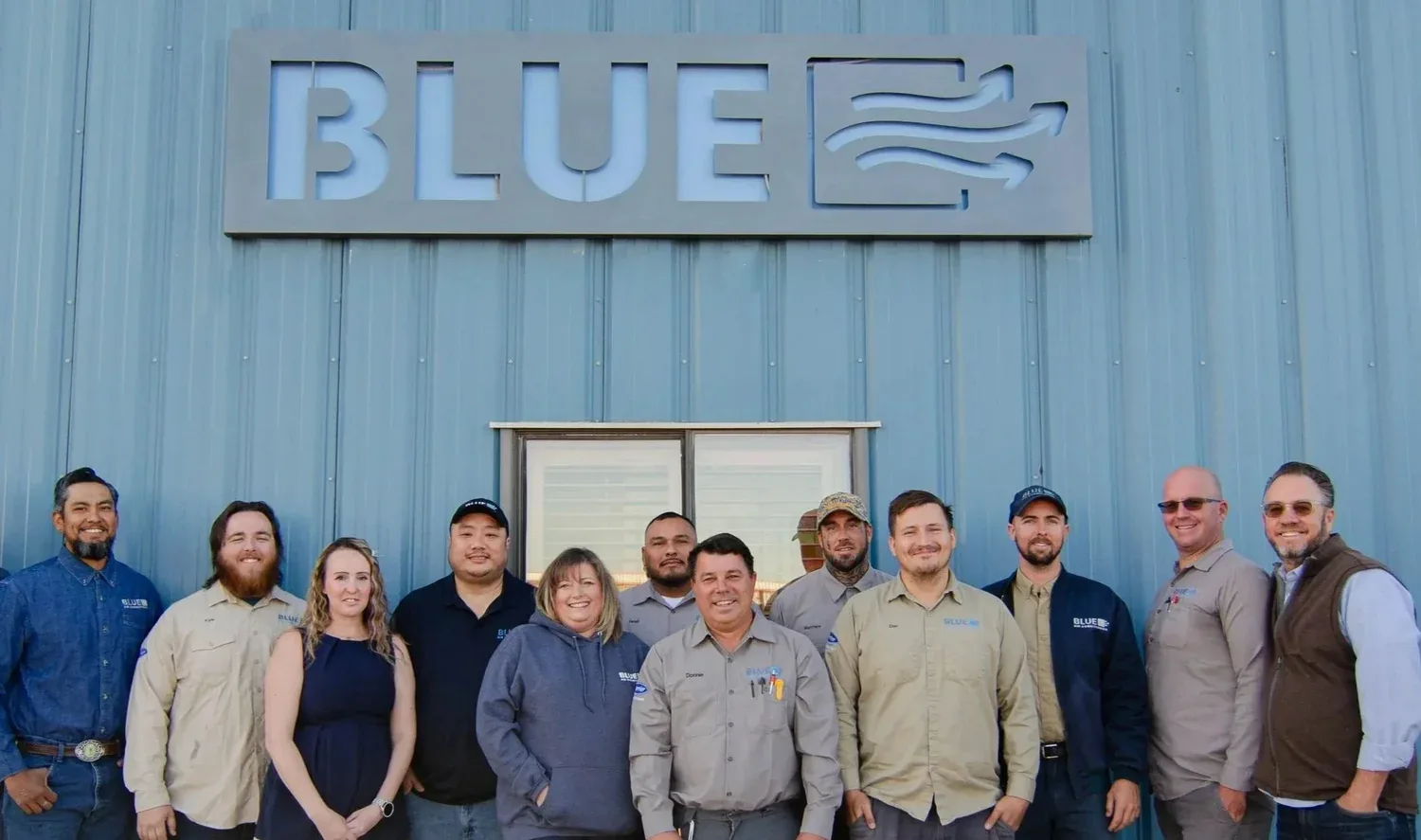 Blue Air Conditioning team outside the company building